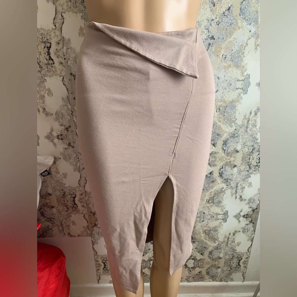 TAN SKIRT WITH ASYMMETRICAL DETAILING ** small tear in back **